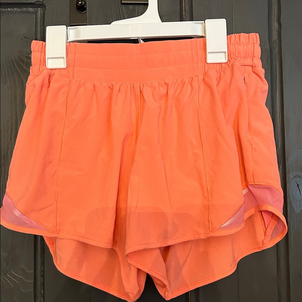 NWOT pink/peach running shorts. Lululemon.